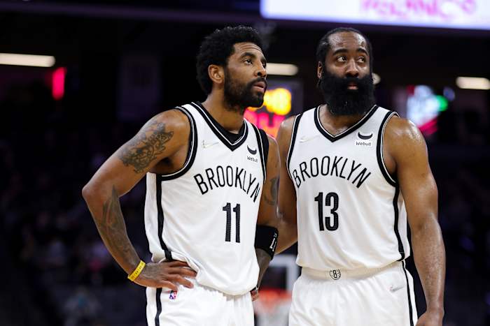 Brooklyn Nets guard Kyrie Irving (11) and guard James Harden (13) talk during the fourth quarter against the Sacramento Kings at Golden 1 Center.